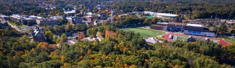 Aerial of campus over college woods